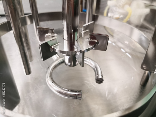 Konstfotografi Stirring part inside a small laboratory scale reactor for scientific and industr