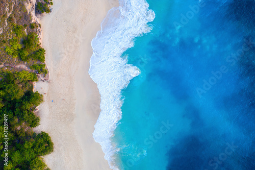 Aerial view of Kelingking Beach in Nusa Penida island, Bali in Indonesia.