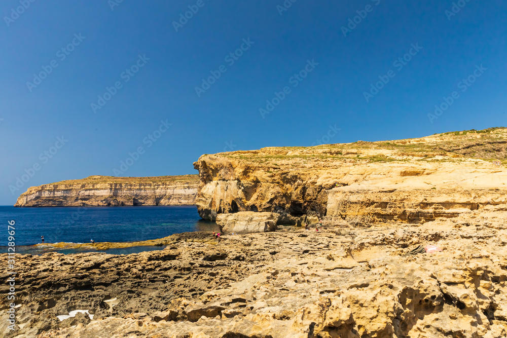 Ruins of Azure Windows in Dwejra Bay in Malta with its dramatic coastal formations