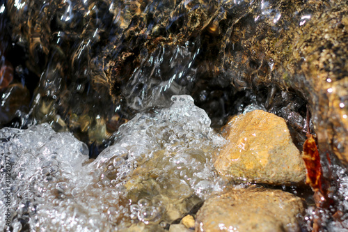 smooth clear water float on stone,rock water movement