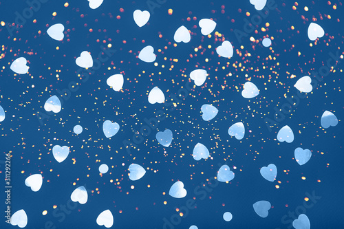 Little hearts confetti on blue background