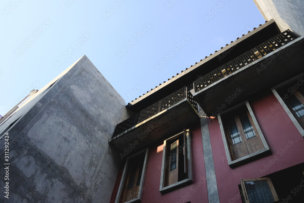 details of a modern loft construction of houses and clean blue sky, contrast of buildings. details of a modern loft construction of houses and clean blue sky, contrast of buildings.