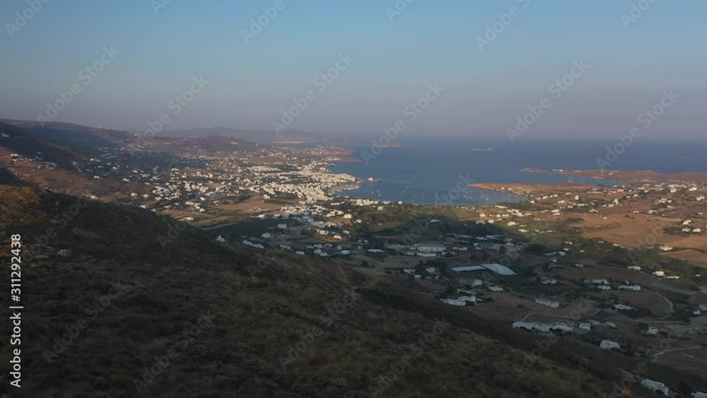 Drone shot flying over small whitewashed church in Greek Island of Paros Drone shot flying over small whitewashed church in Greek Island of Paros