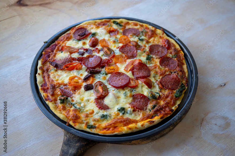 Chorizo, tomato and mozzarella cheese pizza