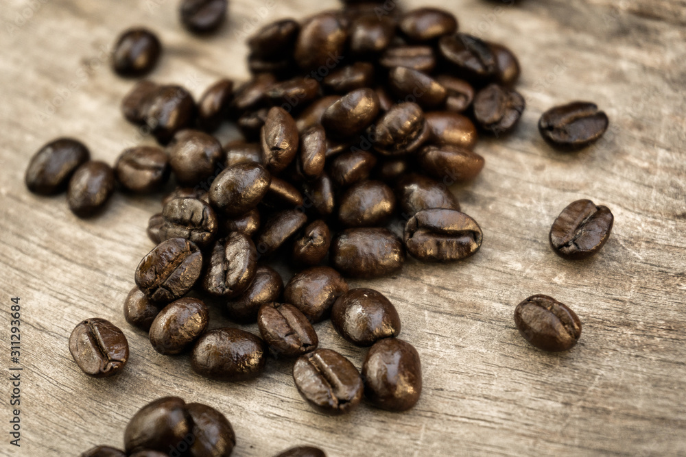 coffee beans on wooden background coffee beans on wooden background