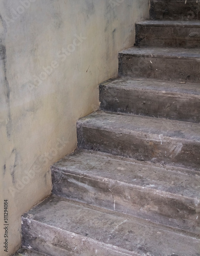 Concrete staircase under construction without decoration. Close-up view.