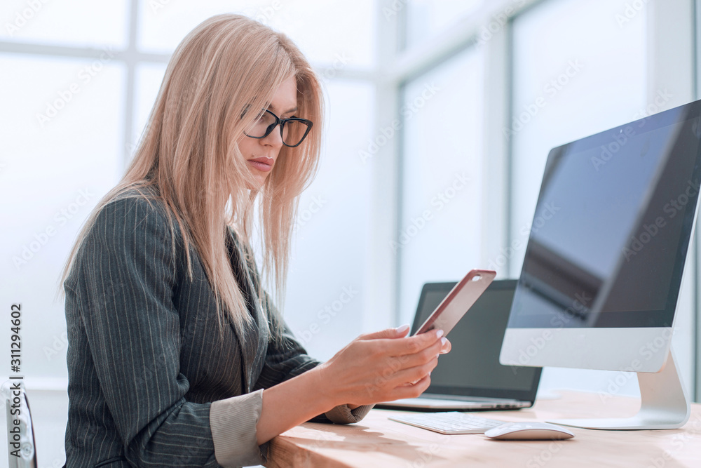 young businesswoman sitting at the office table. young businesswoman sitting at the office table.