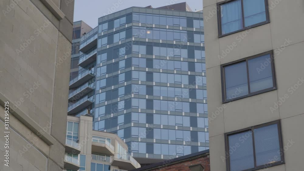 tracking medium shots of buildings moving in the forground and background.