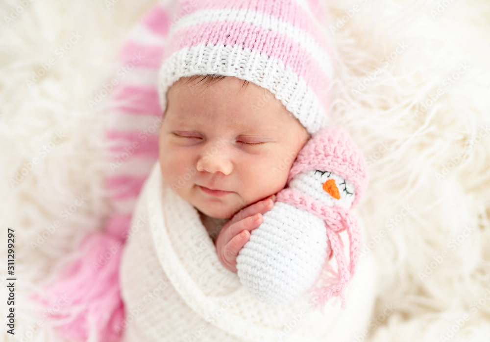 Newborn holding toy Newborn holding toy