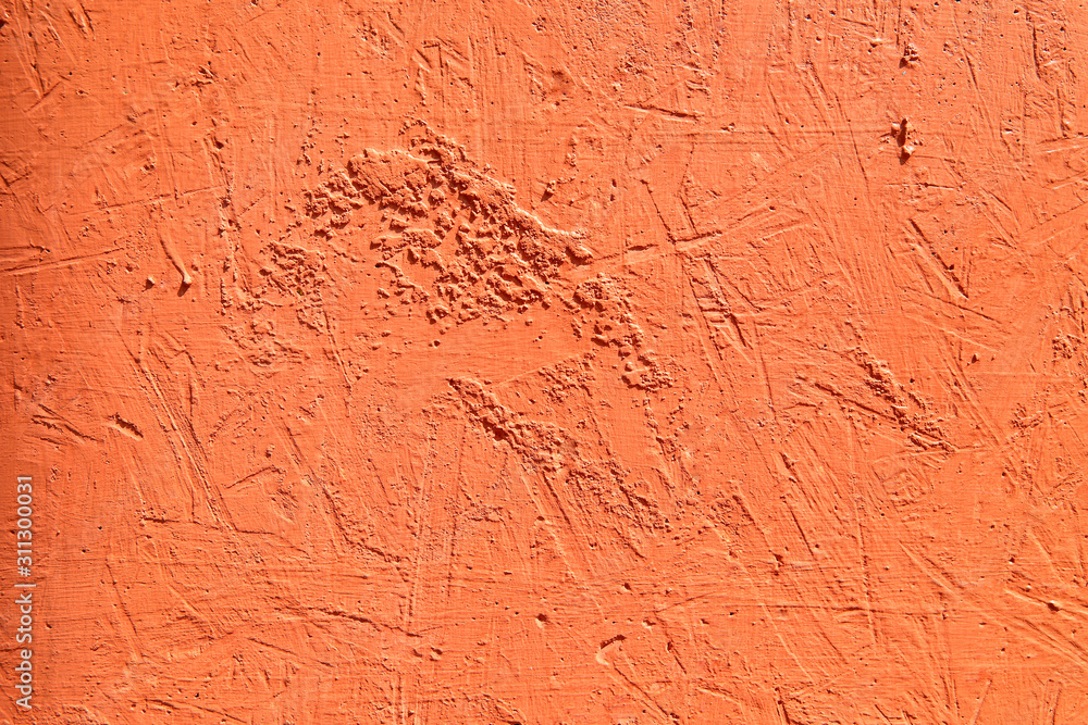 Bright orange textured background. Cement surface with cracks and scratches painted with orange paint. Close-up, top view, horizontal, plenty of free space for text. Bright orange textured background. Cement surface with cracks and scratches painted with orange paint. Close-up, top view, horizontal, plenty of free space for text.