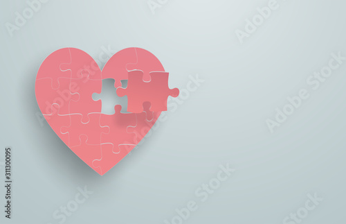 Pink heart-shaped puzzle That the last piece is going to be assembled with the main part Floating on a plain light green background, feel happy love in valentine