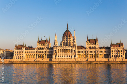 Budapest parliament building during sunset with reflection in Danube river