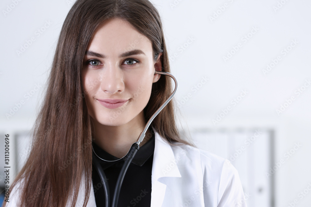 Beautiful smiling female doctor hold in hand Beautiful smiling female doctor hold in hand