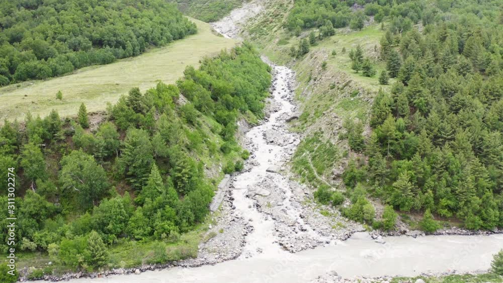 forest river side of spiti valley and going to pin valley in Kinnaur district of Himachal Pradesh. aerial view of chitkul village drone view of pin valley river bridge forest river side of spiti valley and going to pin valley in Kinnaur district of Himachal Pradesh. aerial view of chitkul village drone view of pin valley river bridge