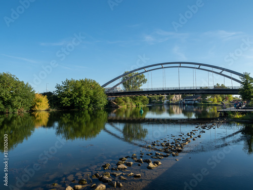 Heilbronn, Germany - September 15th, 2019: Metal bridge across Neckar river, Heilbronn Germany © Keerathi