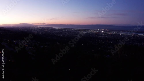 Sunrise as day breaks over the urban city in the morning. photo