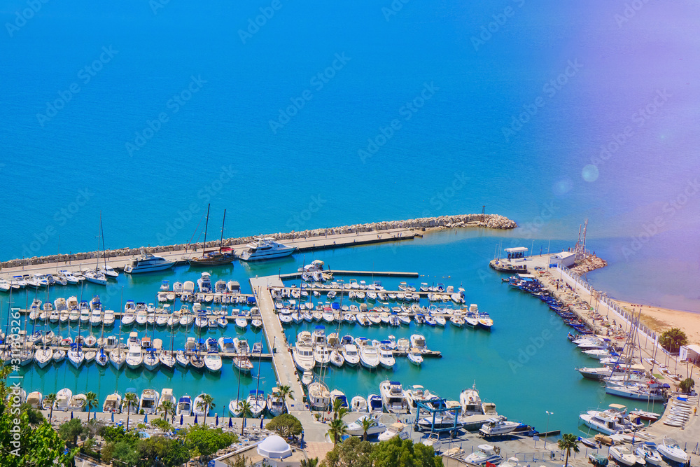 Top view of the pier, lagoon with yachts in Sidi Bou Said. Copy space, wallpaper background. Mediterranean, Tunisia - June 2019