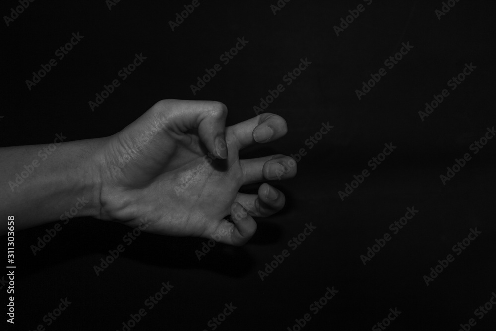 Fototapeta premium Monochrome hand gestures on black background