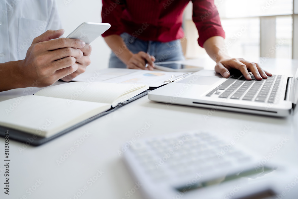 Team of Business people discussing a project of financial plan for marketing. Team of Business people discussing a project of financial plan for marketing.