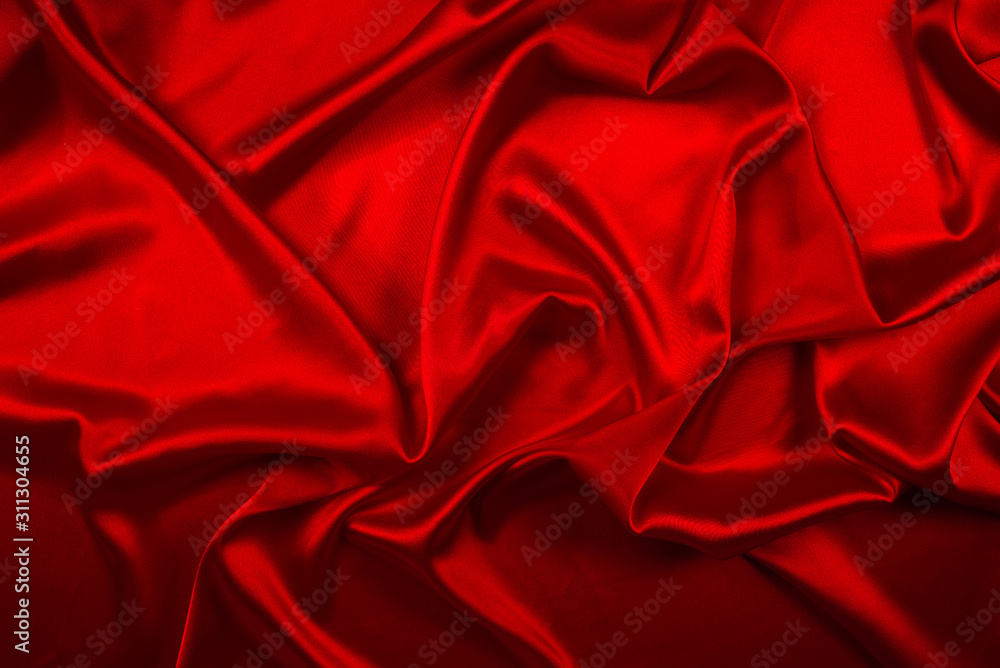 Red silk or satin luxury fabric texture can use as abstract background. Top view. Red silk or satin luxury fabric texture can use as abstract background. Top view.