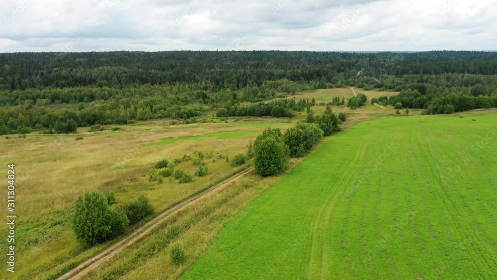 Video drone aerial view over the country road in the agricultural area Video drone aerial view over the country road in the agricultural area