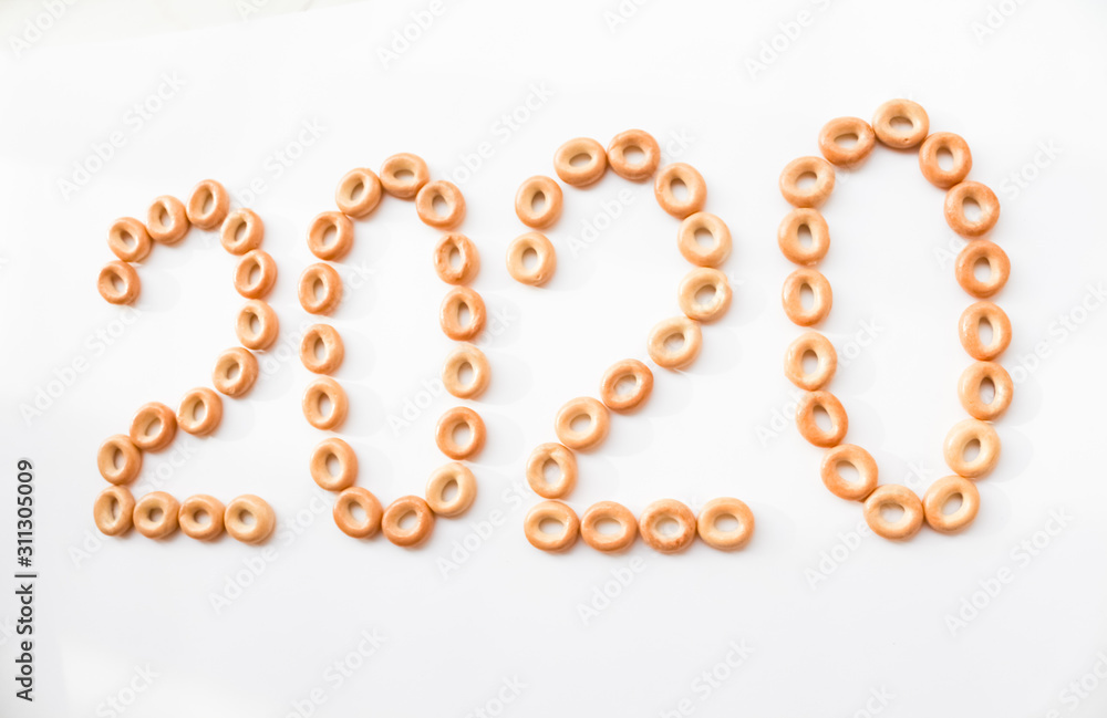  2020 from food on a white background. new Year. bagels, donuts
