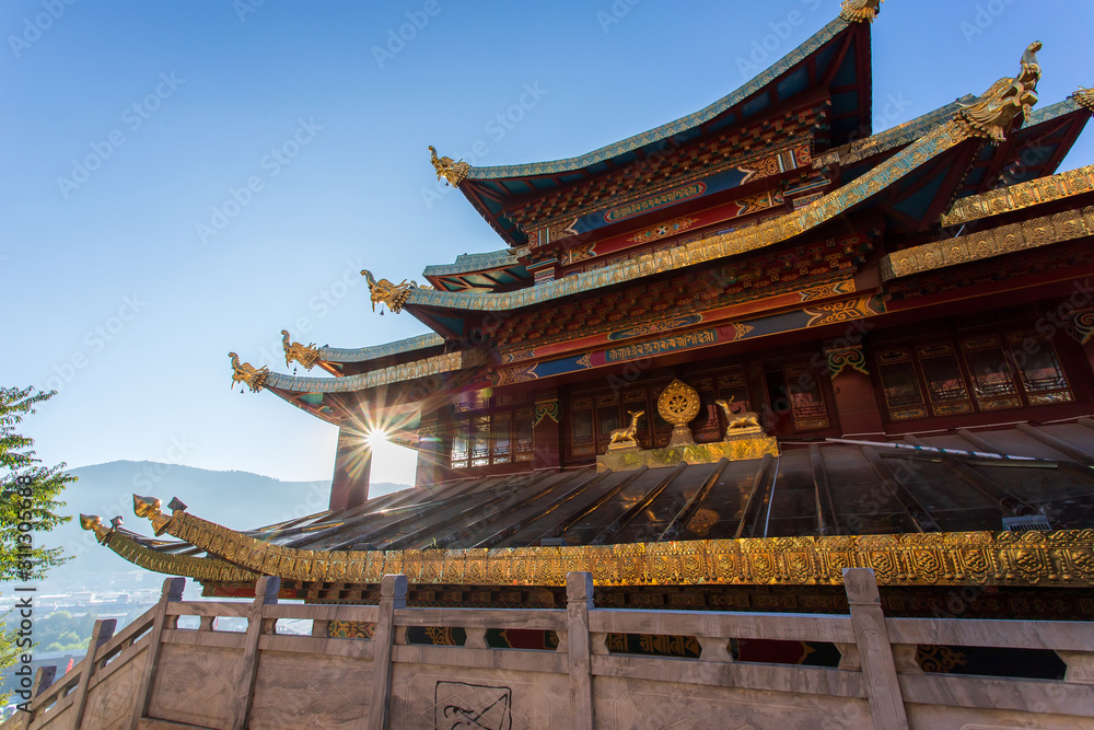 Guishan temple with giant buddhist tibetan prayer golden wheel in old town Shangri la Guishan temple with giant buddhist tibetan prayer golden wheel in old town Shangri la