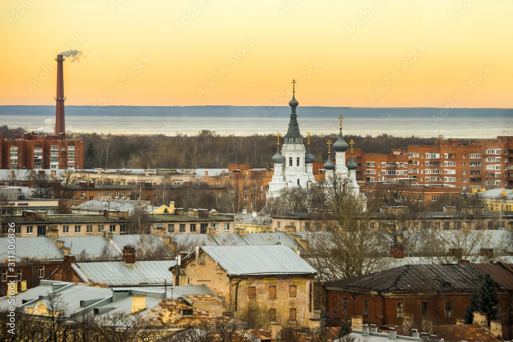 Fototapeta premium Evening view of the Kronstadt town with the Gulf of Finland on the horizon.