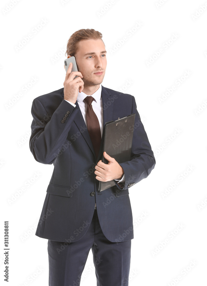 Male real estate agent talking by mobile phone on white background Male real estate agent talking by mobile phone on white background