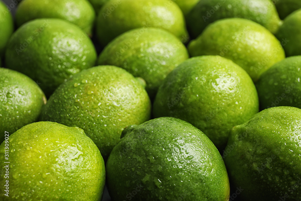 Fresh ripe juicy limes as background, closeup Fresh ripe juicy limes as background, closeup