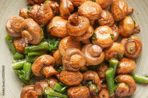Plate with tasty cooked mushrooms and green beans, closeup © Pixel-Shot