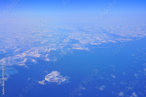 Aerial view of the Labrador Newfoundland area near Nutak and Nain, Canada, covered with ice and snow in winter