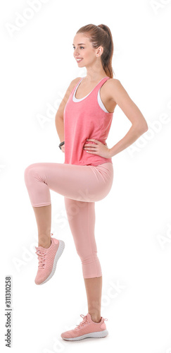 Sporty young woman training against white background © Pixel-Shot