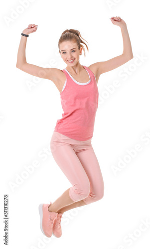 Sporty jumping young woman against white background