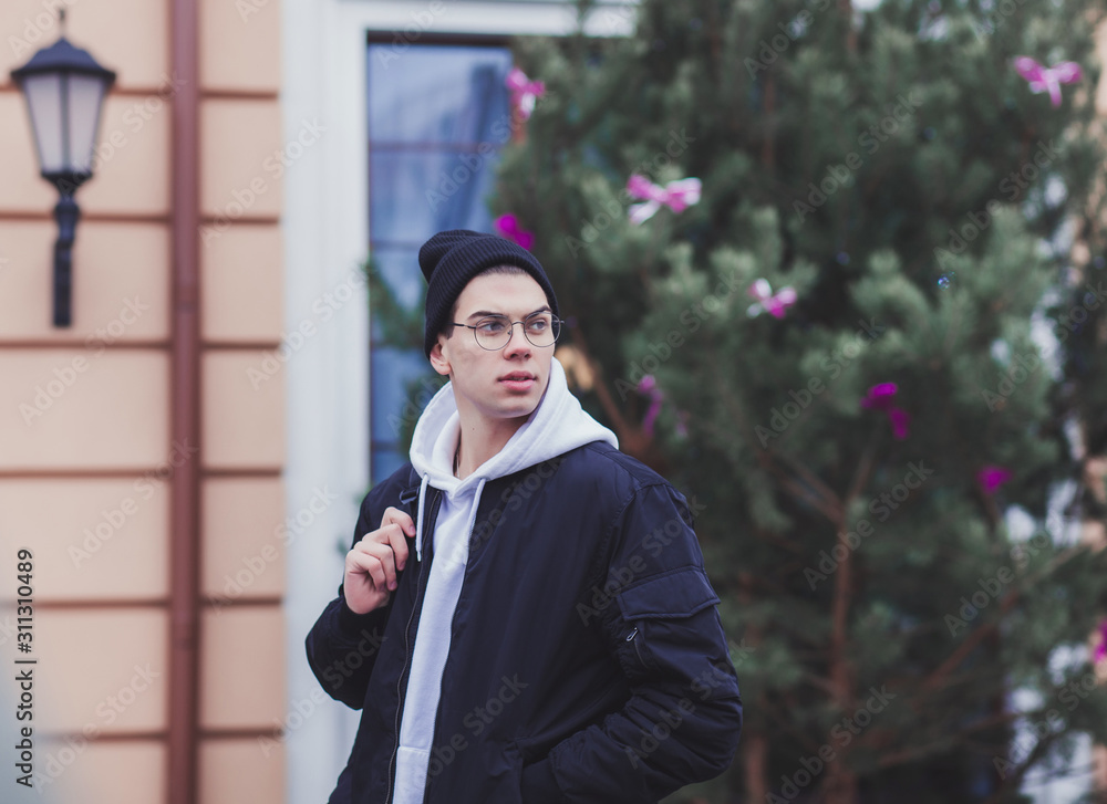 Handsome fashionable young man with glasses in autumn jacket. Handsome fashionable young man with glasses in autumn jacket.