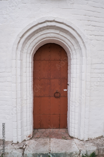 Old iron door of the cathedral. Door in the church