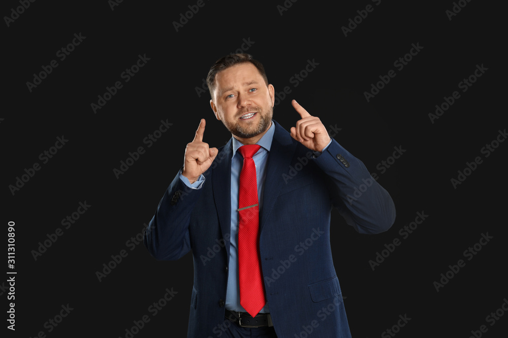 Portrait of happy mature man on black background Portrait of happy mature man on black background