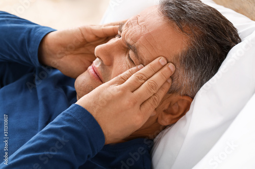 Mature man suffering from h...
