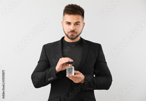 Handsome young man with bot...