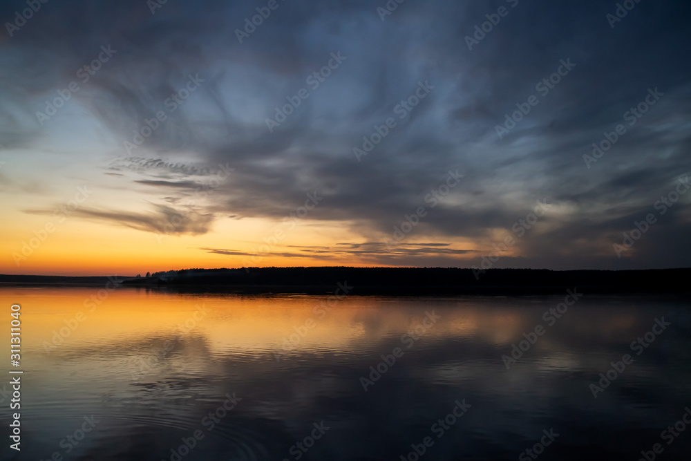 Natural photo background. Blur sunset over the lake 
