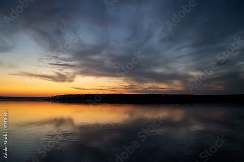Natural photo background. Blur sunset over the lake  © Prozhekter 