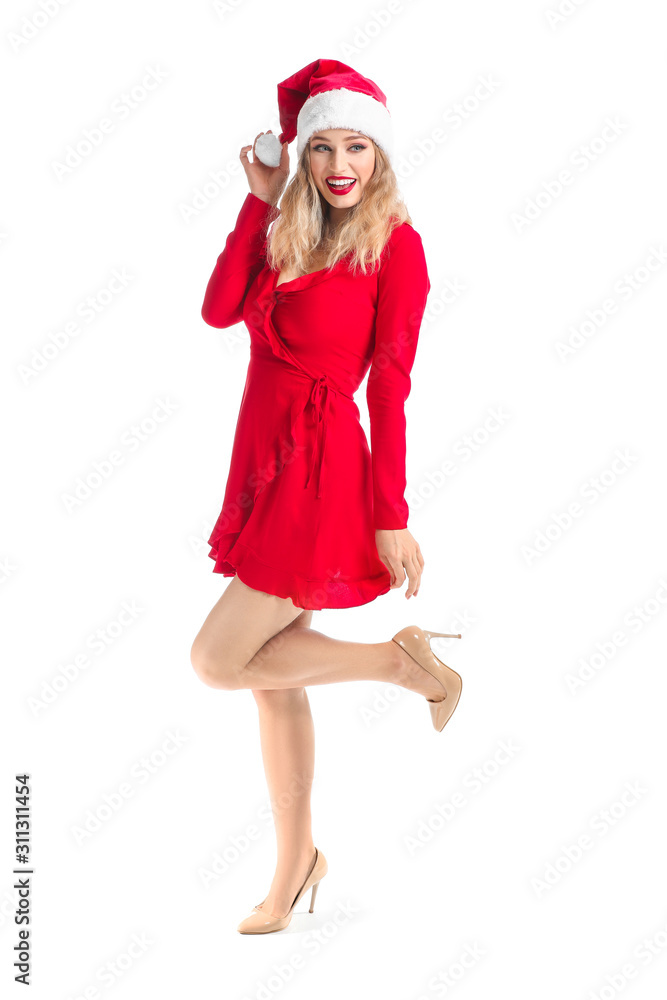 Beautiful young woman in Santa hat on white background Beautiful young woman in Santa hat on white background