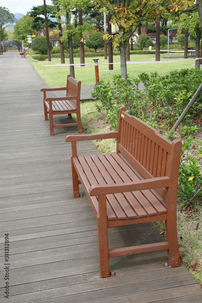 Bench in an empty park. Busan citizens park. Bench in an empty park. Busan citizens park.