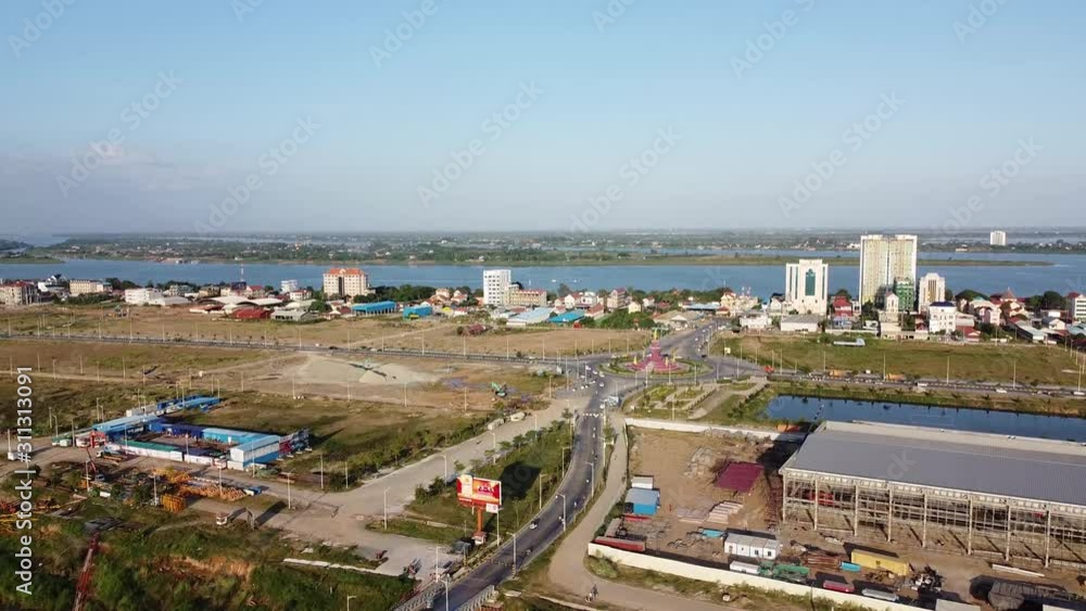 Aerial flight over Phom Phen city with roundabout beside Mekong river,Cambodia Aerial flight over Phom Phen city with roundabout beside Mekong river,Cambodia
