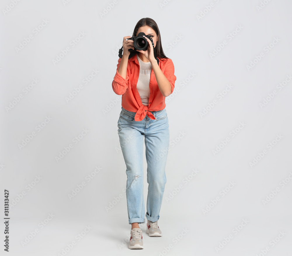 Professional photographer working on white background in studio Professional photographer working on white background in studio