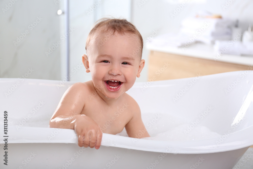 Cute little baby in bathtub at home Cute little baby in bathtub at home