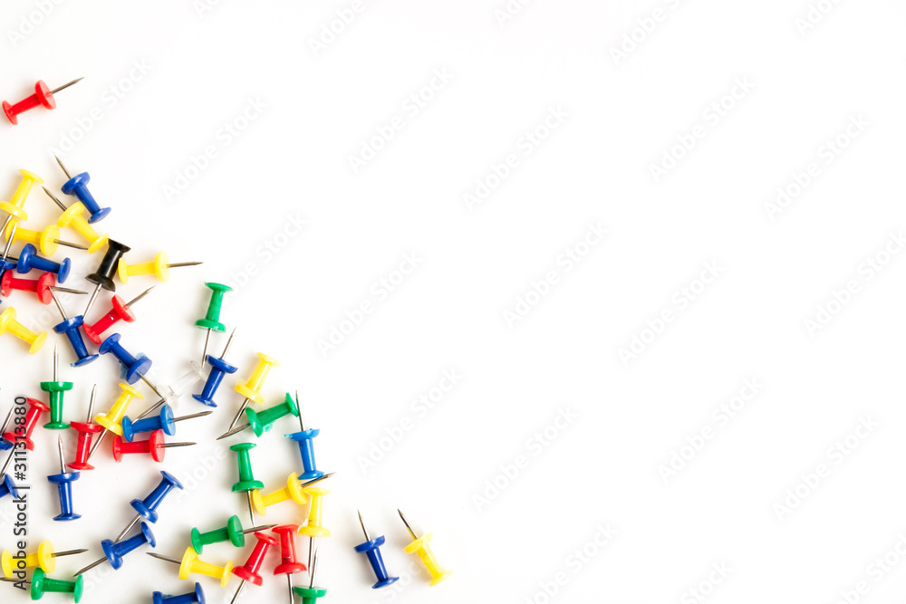 Colorful push pins isolated on white background