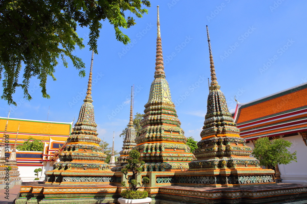 Naklejka premium Chedis with a single base in Wat Pho,Temple of the Reclining Buddha,Wat Phra Chetuphon Wimon Mangkhalaram Rajwaramahawihan Bangkok Thailand