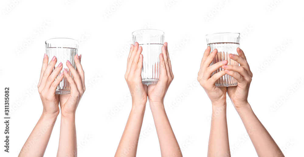 Female hands with glasses of water on white background