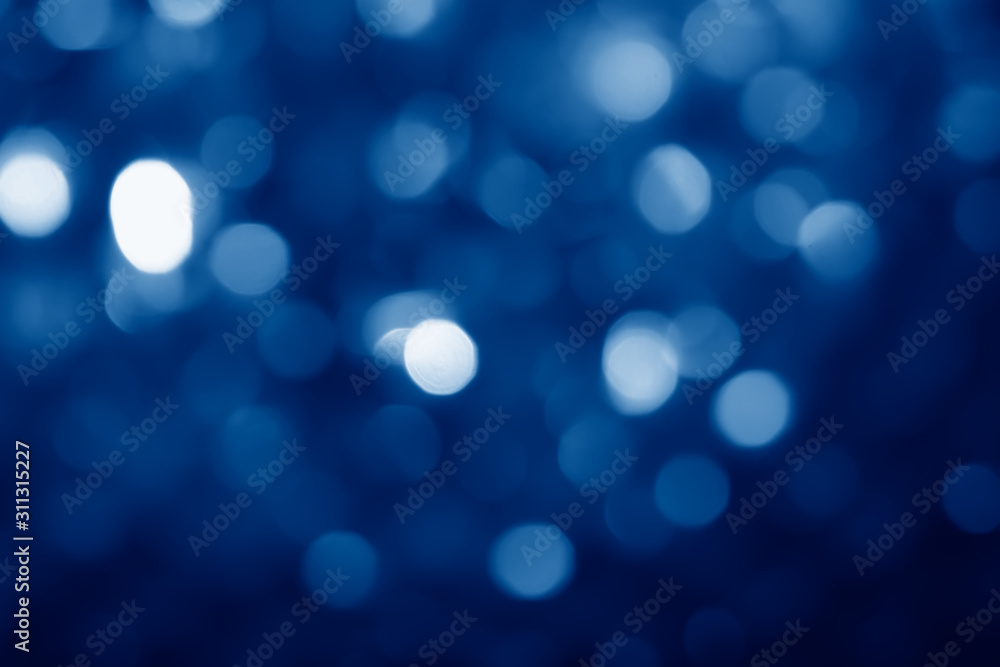 abstract blurred circular bokeh lights background toned in trendy Classic Blue color of the Year 2020 abstract blurred circular bokeh lights background toned in trendy Classic Blue color of the Year 2020